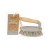 Grey scrubbing brush with bamboo handle and durable bristles, shown with product label attached