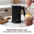 Black Salter milk frother in kitchen, next to hot chocolate with cream.