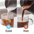 Glass of iced coffee with milk being poured in, on kitchen counter.