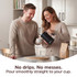 Lifestyle image: electric kettle pouring coffee with drip-free design in kitchen setting