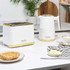 White and gold two-slice toaster with ribbed design in kitchen setting