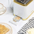 White and gold Salter toaster with two slices of bread, shown in use.
