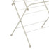 Close-up of cream folding clothes airer frame showing angled legs and drying bars