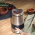 Salter stainless steel electric coffee grinder on wooden kitchen worktop