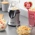 Salter hot air popcorn maker on kitchen counter with bowls of popcorn, UK offer: only 30 calories per cup