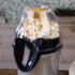 Hot air popcorn maker with kernels and popped corn in clear chamber