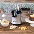 Salter hot air popcorn maker in silver on kitchen worktop, with popcorn, kernels and a chocolate popcorn cake