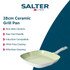 Square green non-stick grill pan with matching Salter frying and wok pans on wooden surface