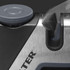 Manual knife sharpener close-up showing sharpening blade in slot