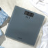 Close-up of digital bathroom scale display showing zero in stones and pounds.