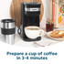Black Salter single-serve coffee maker with travel mug on kitchen counter
