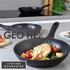 Cooked white fish fillet with black pepper, spinach, asparagus and grilled lemon in frying pan