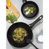 2-piece Salter non-stick pan set, black, with cooked stir fry and vegetables, shown top-down