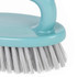 Light blue handheld scrubbing brush with white bristles, shown close up.