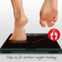 Person stepping onto black Salter digital bathroom scale for instant weight reading