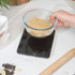 Black digital kitchen scale, showing dimensions 19cm x 16.5cm x 2cm