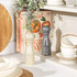 Set of two Salter wooden salt and pepper mills, cream and grey, on kitchen shelf
