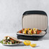 Electric grill open showing non-stick ridged plates in grey, empty and ready for use