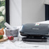 Salter black electric grill on marble kitchen worktop with onion, chilli and mortar nearby
