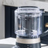 Food processor bowl with stainless steel chopping blade, top down view