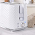 White textured 2-slice toaster with chrome trim, shown on kitchen counter