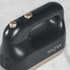 Close-up of Salter black and gold hand mixer handle showing control buttons