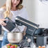 Black and silver Salter stand mixer in use on kitchen counter