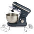 Grey stand mixer with stainless steel bowl, whisk attached, and two dough attachments.