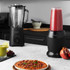 Black Salter blender with smoothie ingredients in cup on kitchen counter
