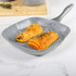 Grey square non-stick grill pan with handle, shown from top view