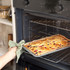 Grey non-stick baking tray with four cookies, promotion for Salter Marblestone 37cm tray