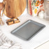 Grey speckled non-stick baking tray, shown from above