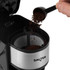 Silver and black filter coffee maker with travel mug and digital display