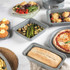 Set of grey non-stick bakeware including trays, tins, roaster and muffin pan on kitchen counter