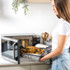 Salter black microwave on kitchen counter with bread and bowl in foreground