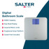 Silver digital bathroom scale with large backlit display, shown from above