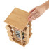 Bamboo rotating spice rack with glass jars, shown with hand holding the lid