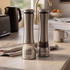 Salter electric salt grinder in use next to pepper grinder on kitchen counter