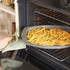 Grey square pizza tray with holes for a crisp base