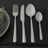 Set of four silver stainless steel cutlery pieces: fork, knife, tablespoon and teaspoon.