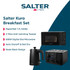 Black electric kettle on kitchen counter with glass cup and tea bags