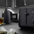 Black Salter kettle and toaster set on kitchen counter with tea and teabags