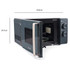 Black microwave oven with door open, hand placing a bowl inside