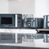 Salter grey microwave, toaster and kettle set on a marble kitchen worktop
