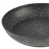 Large round speckled black non-stick frying pan, close-up interior view