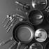 Non-stick cookware set with utensils, black, shown from above