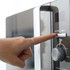 Hand pressing microwave oven start button