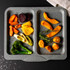 Grey double oven tray with assorted roasted vegetables, shown from above for product detail