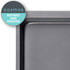 Non-stick grey baking tray, partial top-down view, refined and modern style.