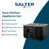 Black electric kettle on kitchen counter with glass cup and tea bags